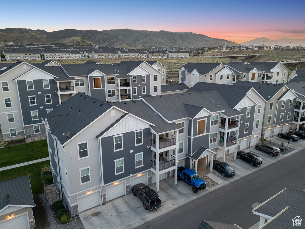 Aerial perspective of suburban area with a mountain backdrop