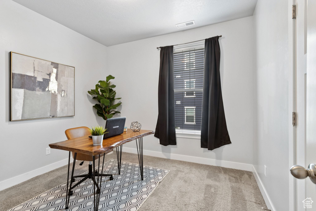 Office featuring carpet and baseboards