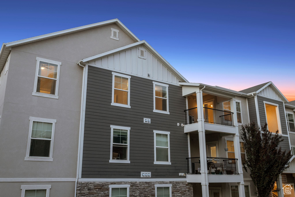 Back of property featuring board and batten siding and stucco siding