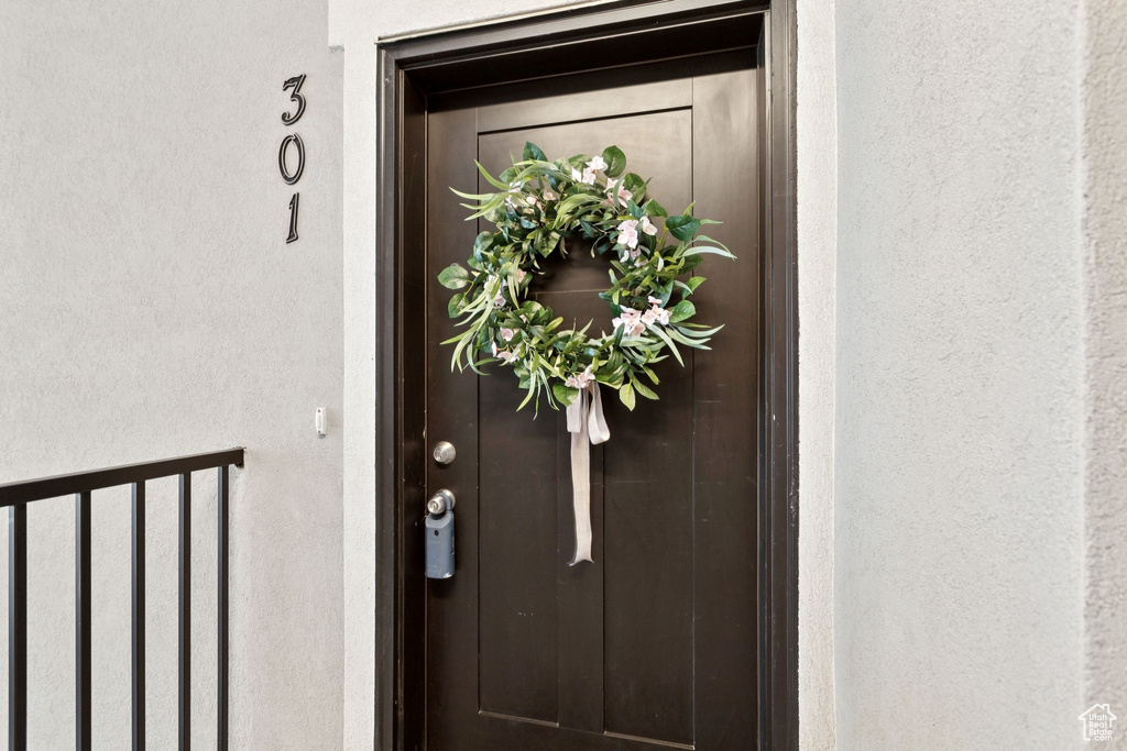 Doorway to property with stucco siding