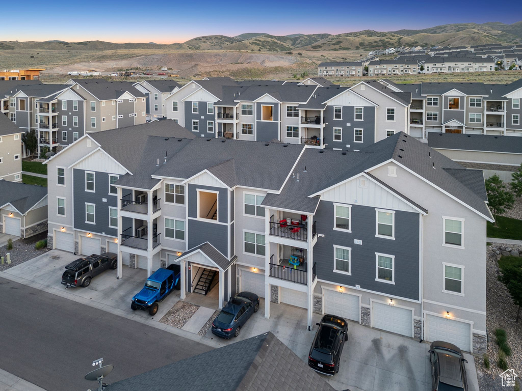Aerial perspective of suburban area with a mountain backdrop