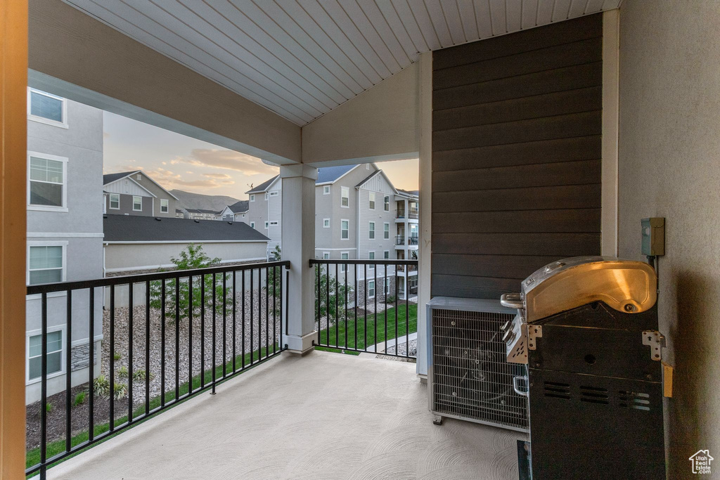 Balcony at dusk with a residential view