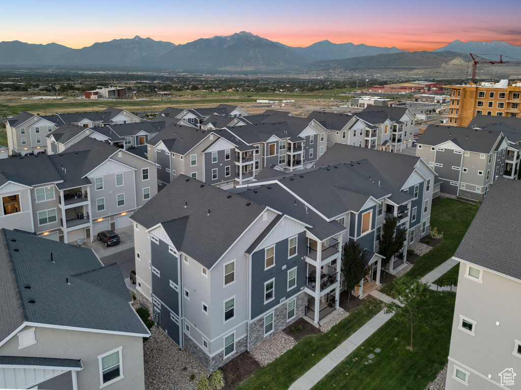 Aerial perspective of suburban area with a mountain backdrop