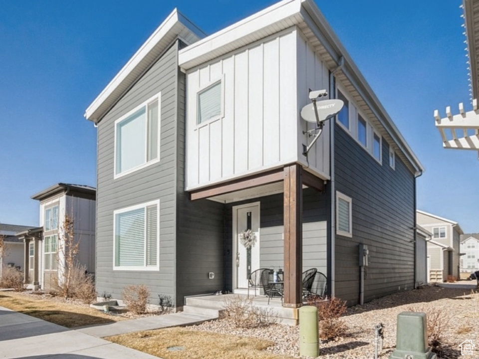 View of front of property featuring board and batten siding and a porch
