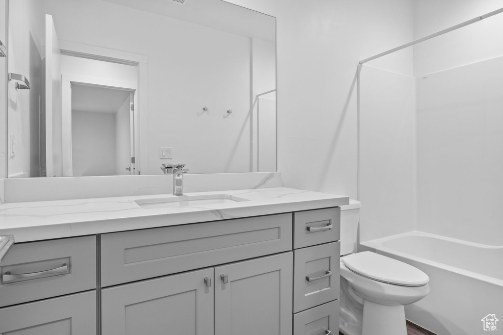 Bathroom featuring vanity and bathing tub / shower combination