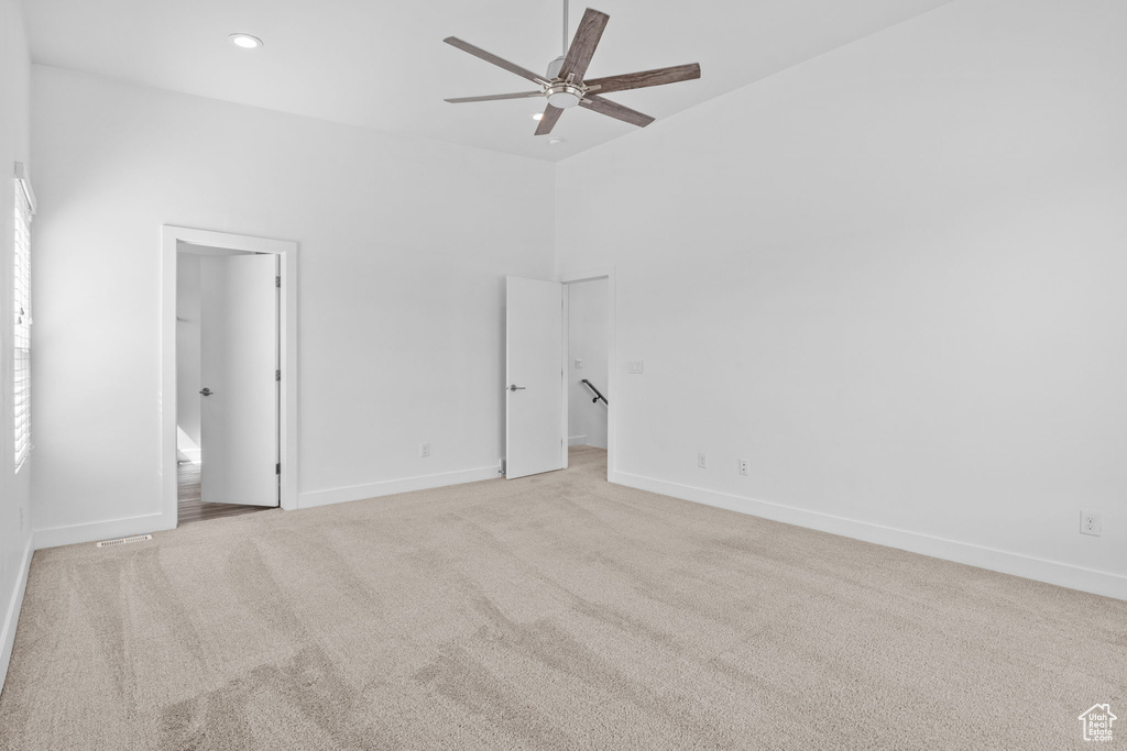 Unfurnished bedroom with carpet floors, recessed lighting, ensuite bathroom, and a spacious closet
