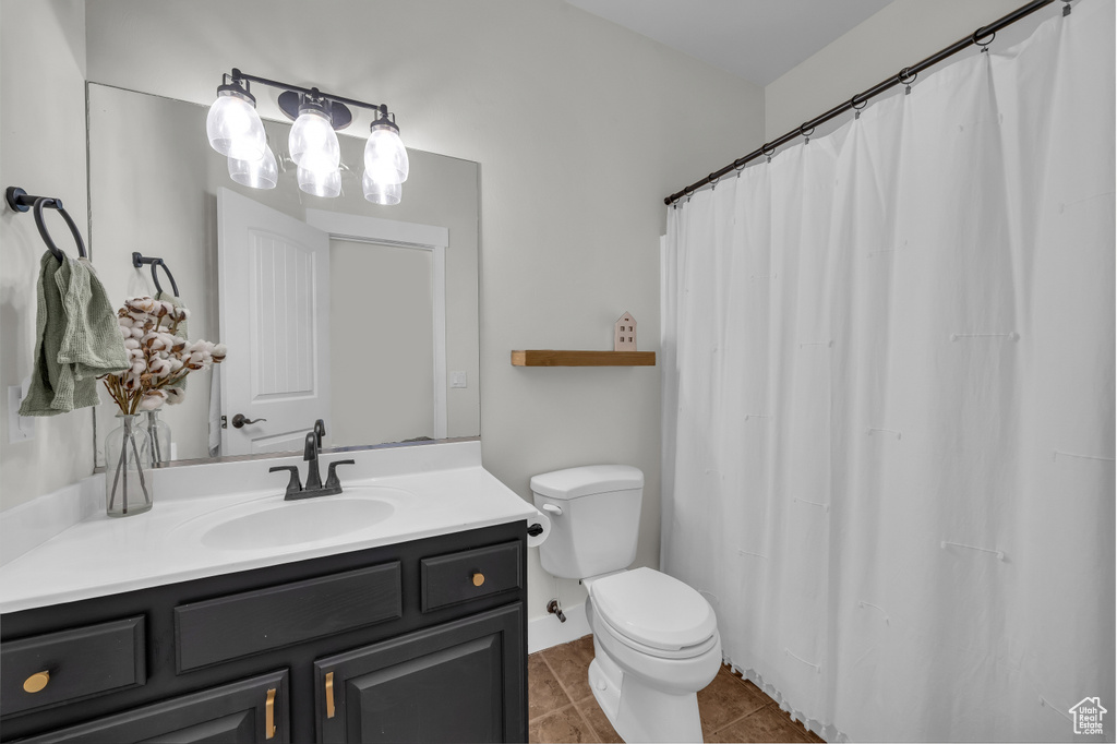 Full bath featuring vanity and tile patterned floors