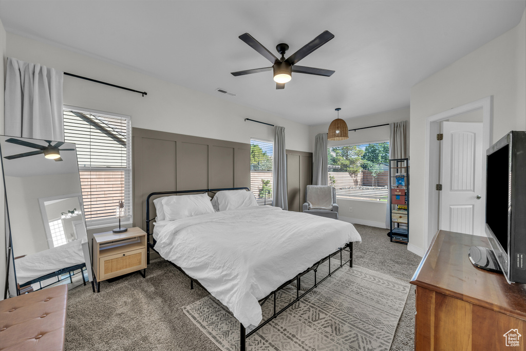 Bedroom with carpet and a ceiling fan