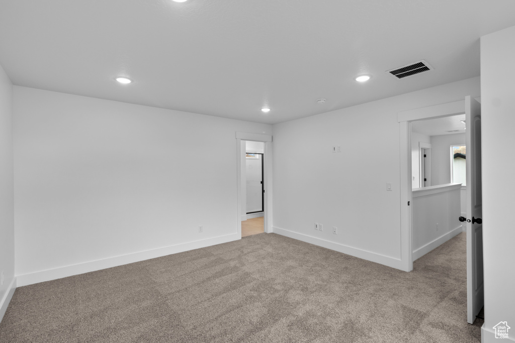 Empty room with recessed lighting and carpet flooring