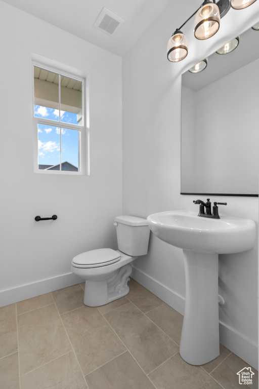 Bathroom with tile patterned flooring