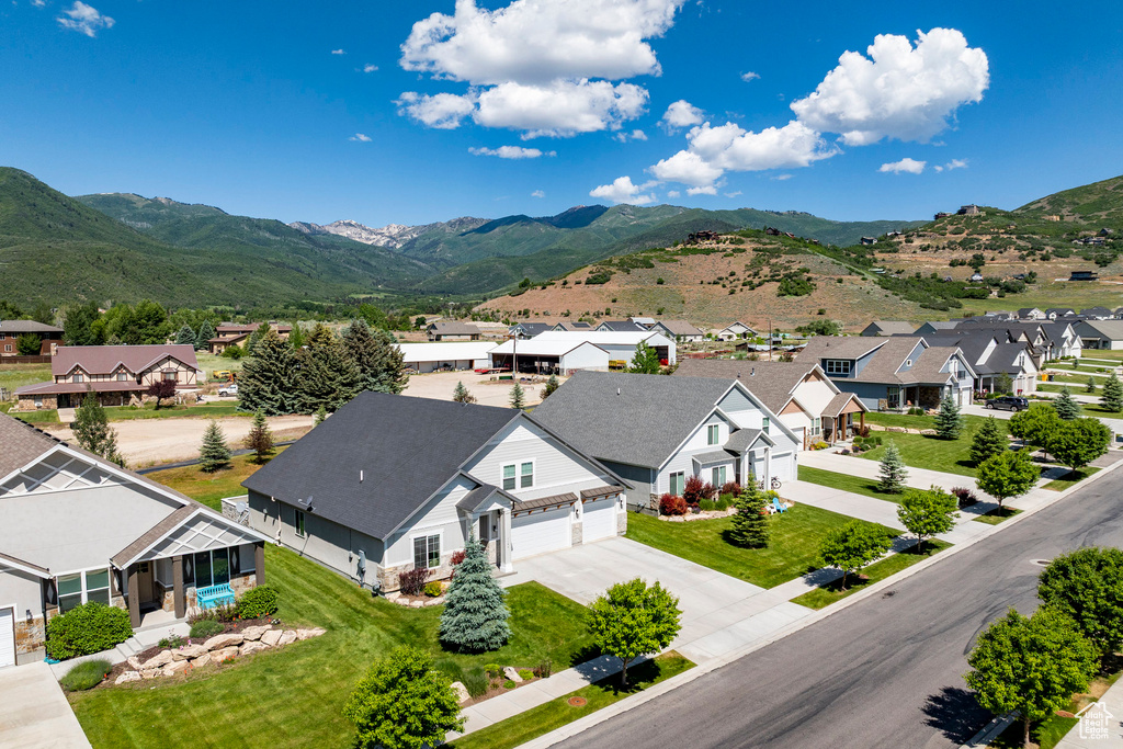 Aerial view of residential area featuring a mountain backdrop