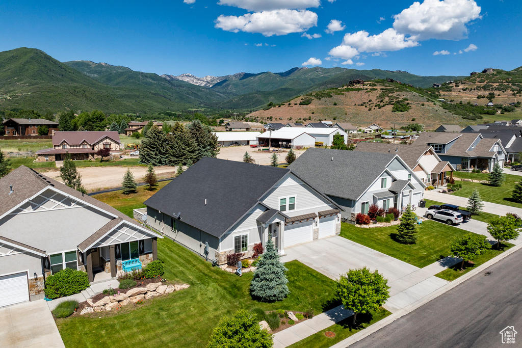 Aerial view of residential area featuring a mountainous background