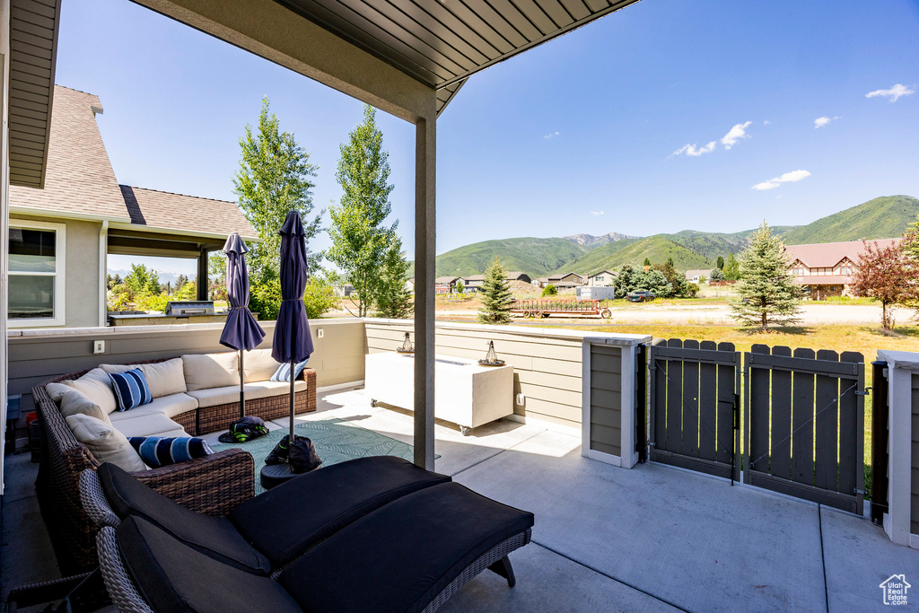 View of patio / terrace featuring a mountain view and an outdoor hangout area