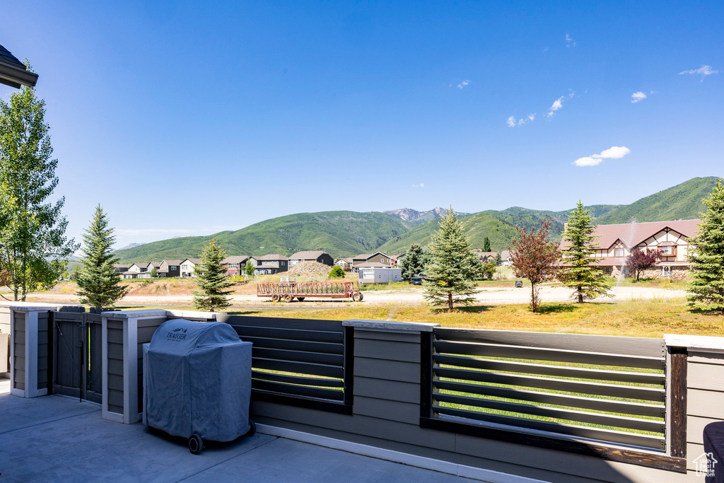 View of mountain backdrop featuring nearby suburban area