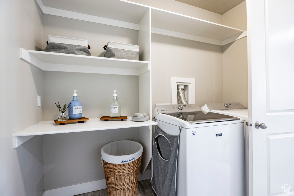 Laundry area with washer and clothes dryer