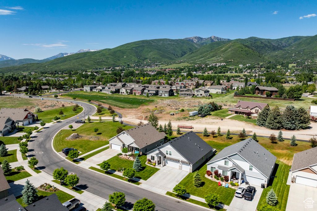 Aerial view of residential area featuring mountains