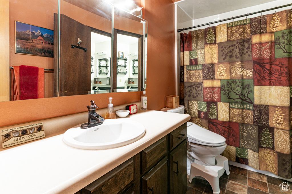 Bathroom featuring vanity and a shower with shower curtain