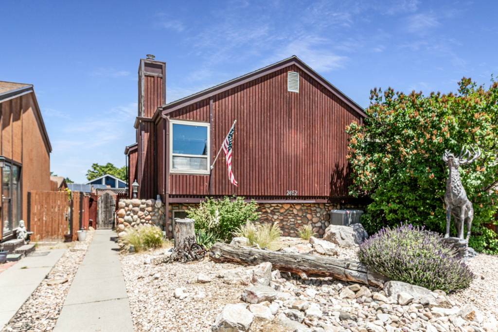 View of side of property with a chimney