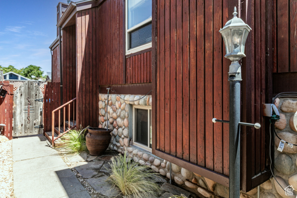 View of property exterior featuring stone siding