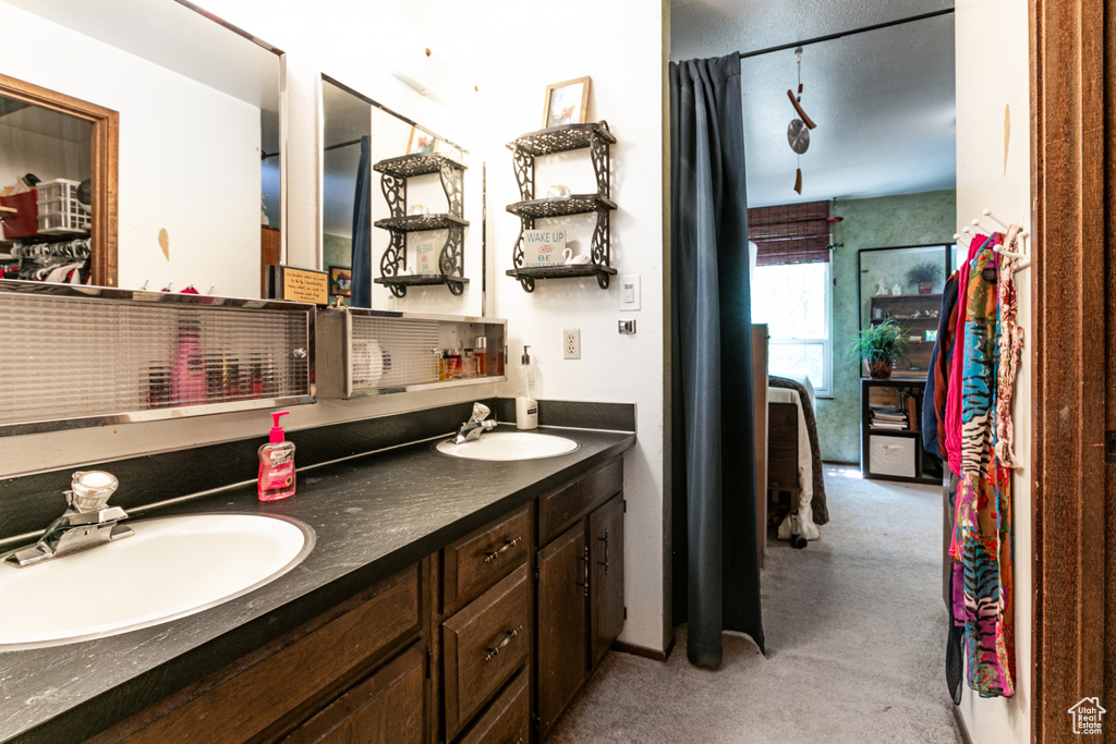 Bathroom featuring double vanity