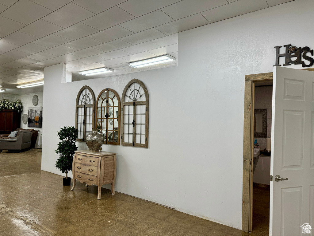 Corridor featuring finished concrete floors