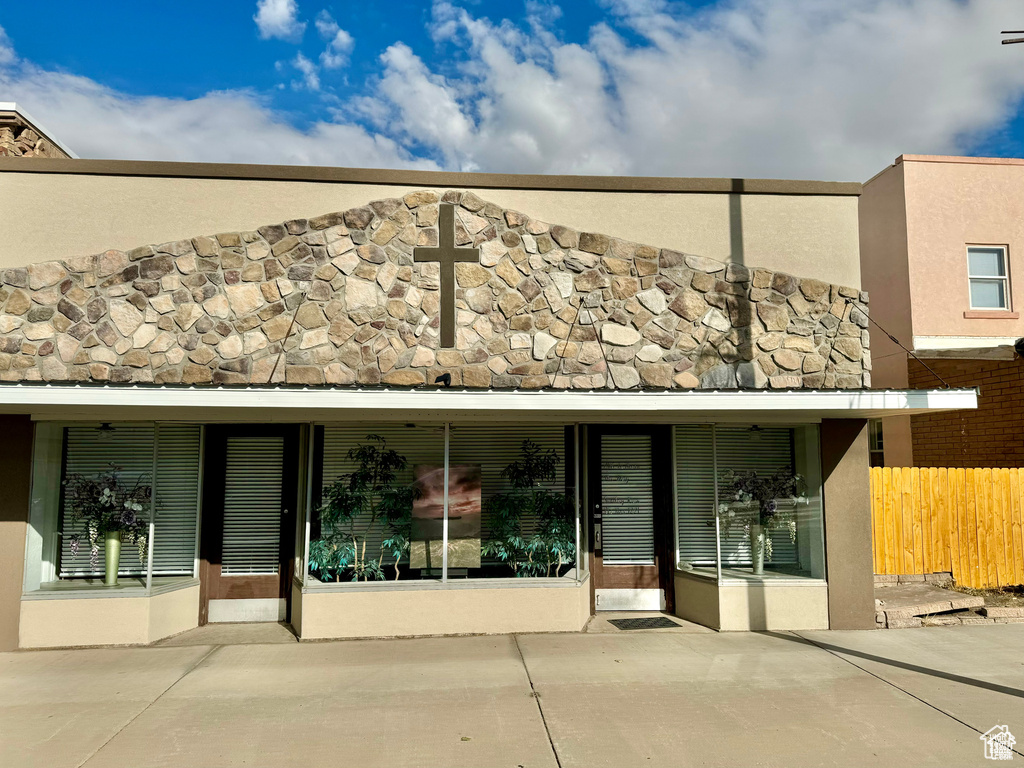 Back of property with a patio area and stucco siding