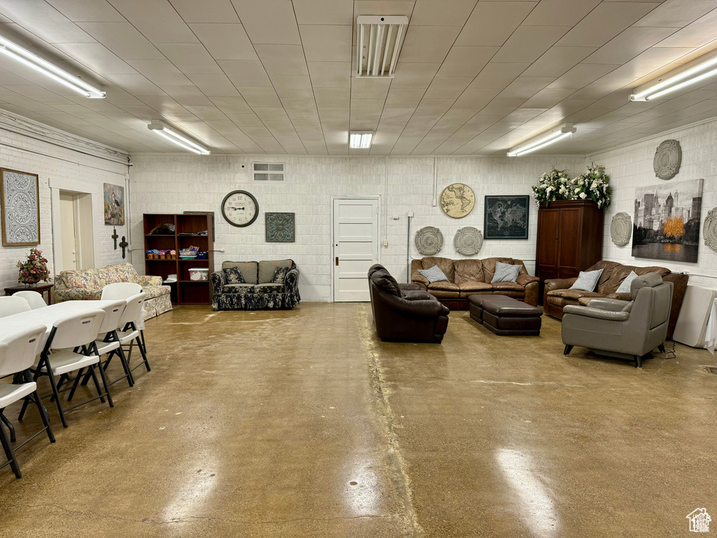 Living room featuring finished concrete flooring