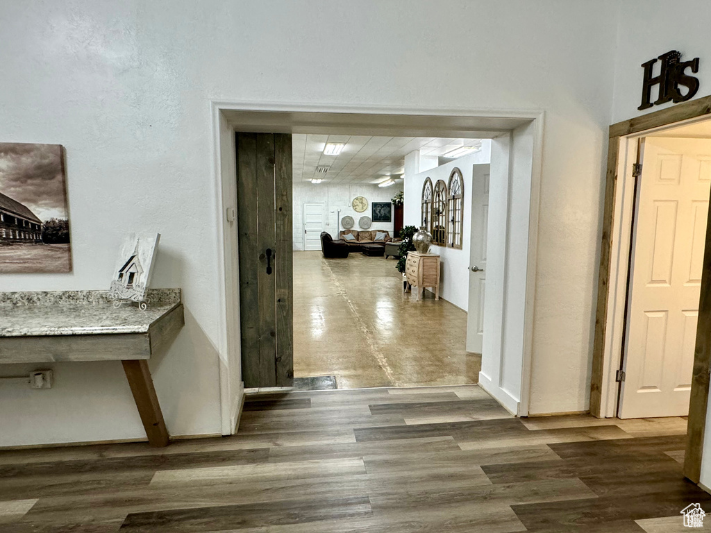 Hall featuring wood finished floors