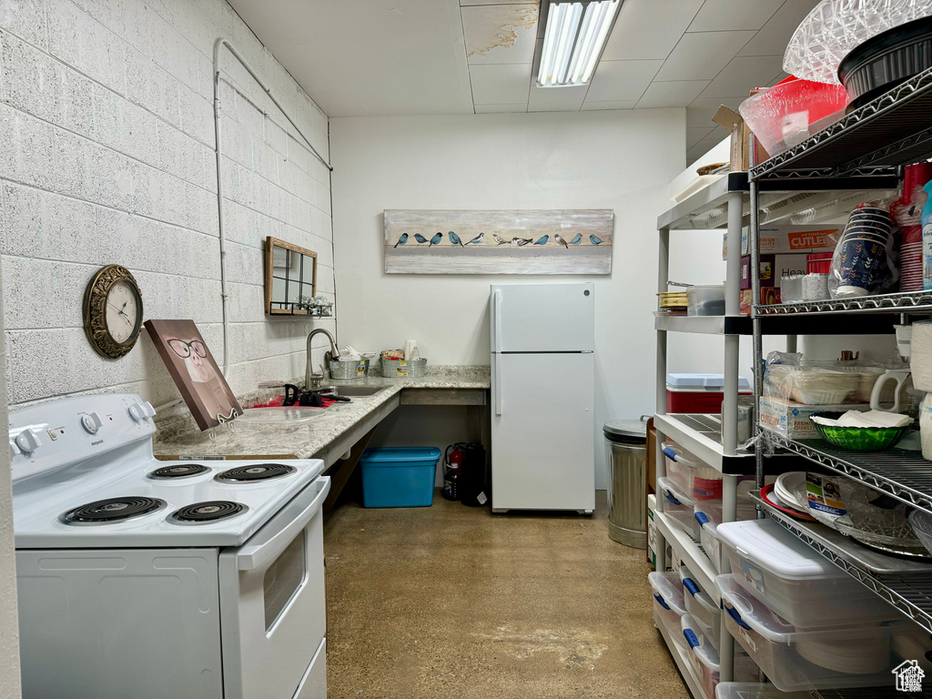 Kitchen with white appliances and light countertops