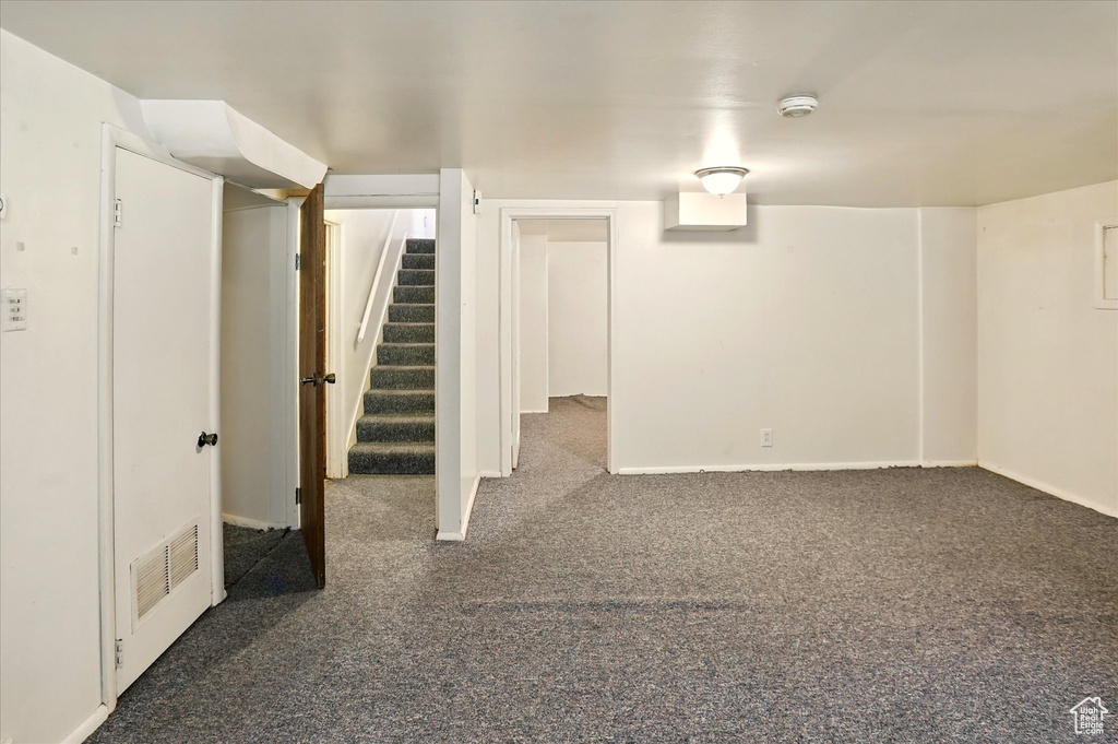 Finished below grade area with carpet floors and stairs