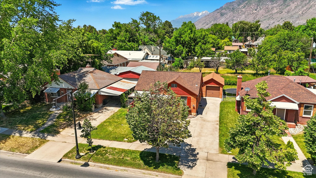 Aerial perspective of suburban area with a mountainous background