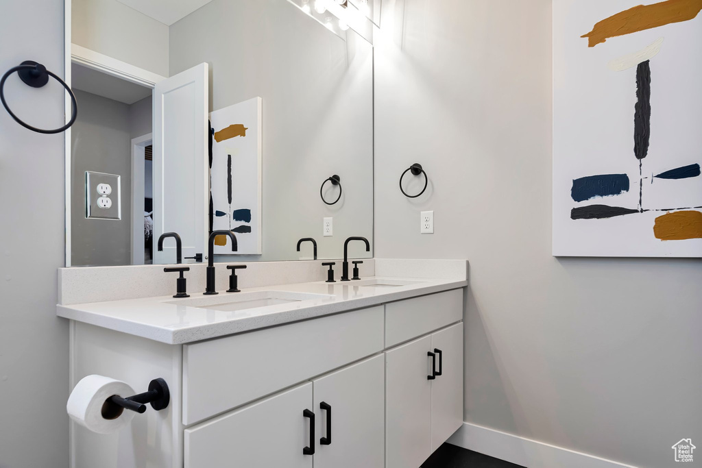 Bathroom featuring double vanity