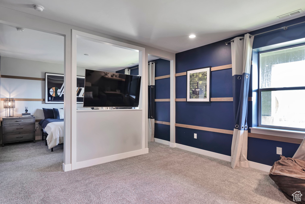 Carpeted bedroom featuring baseboards and recessed lighting