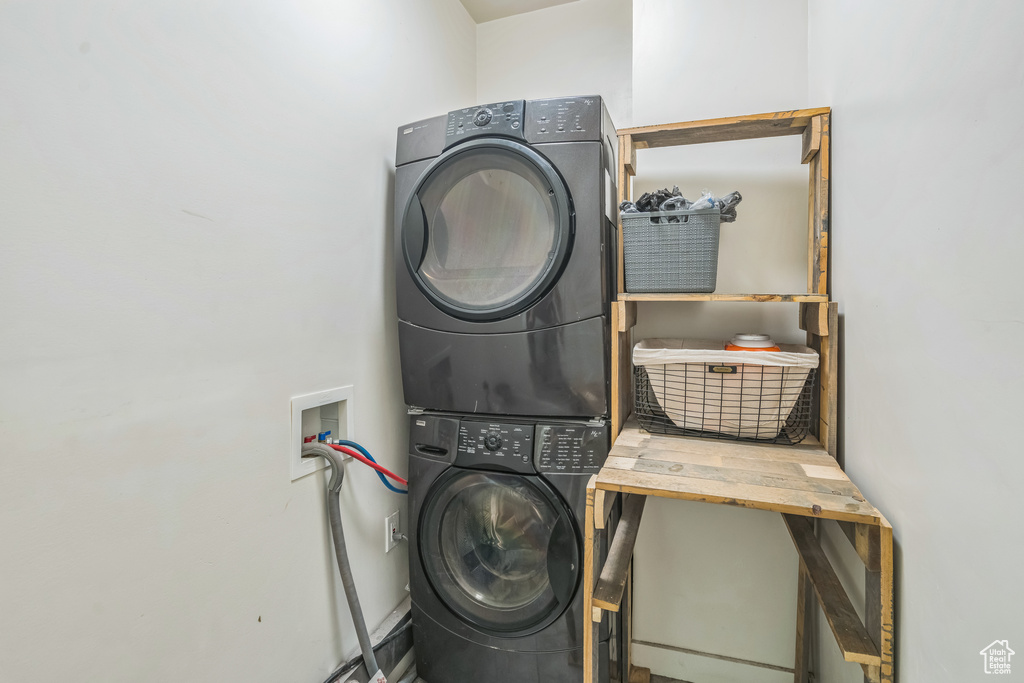 Laundry room featuring estacked washer and dryer