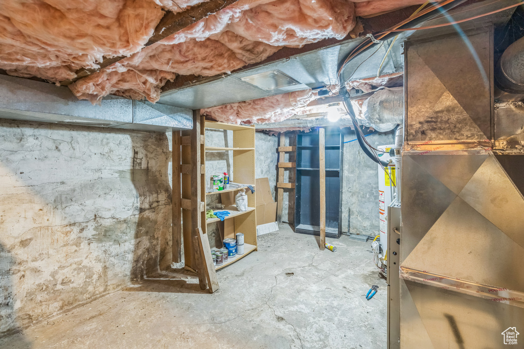 Unfinished below grade area with heating unit