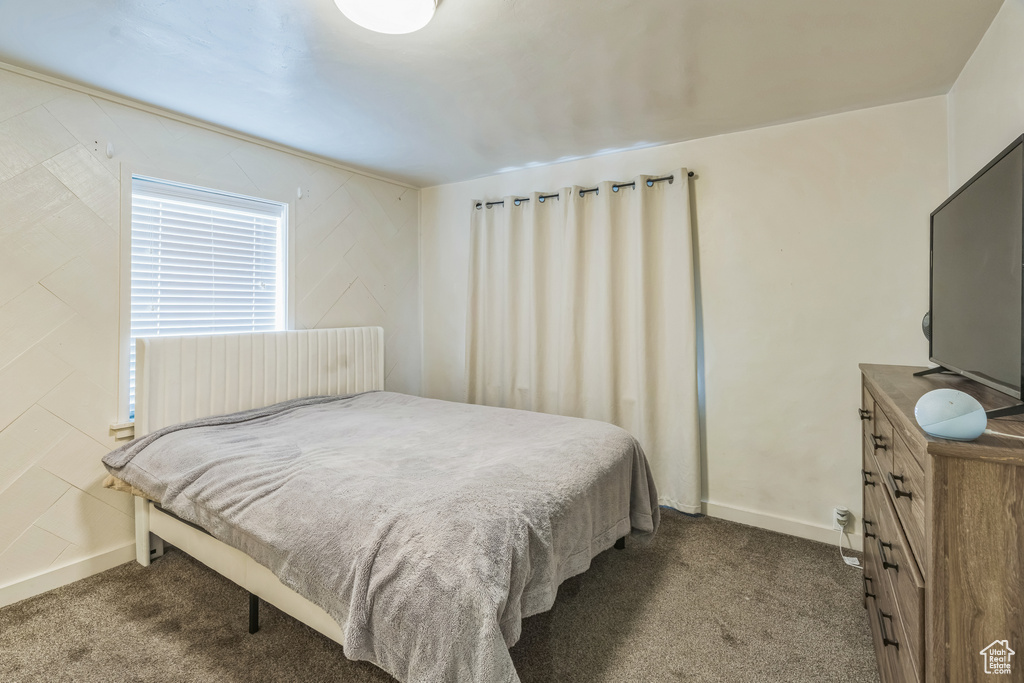 Carpeted bedroom with baseboards