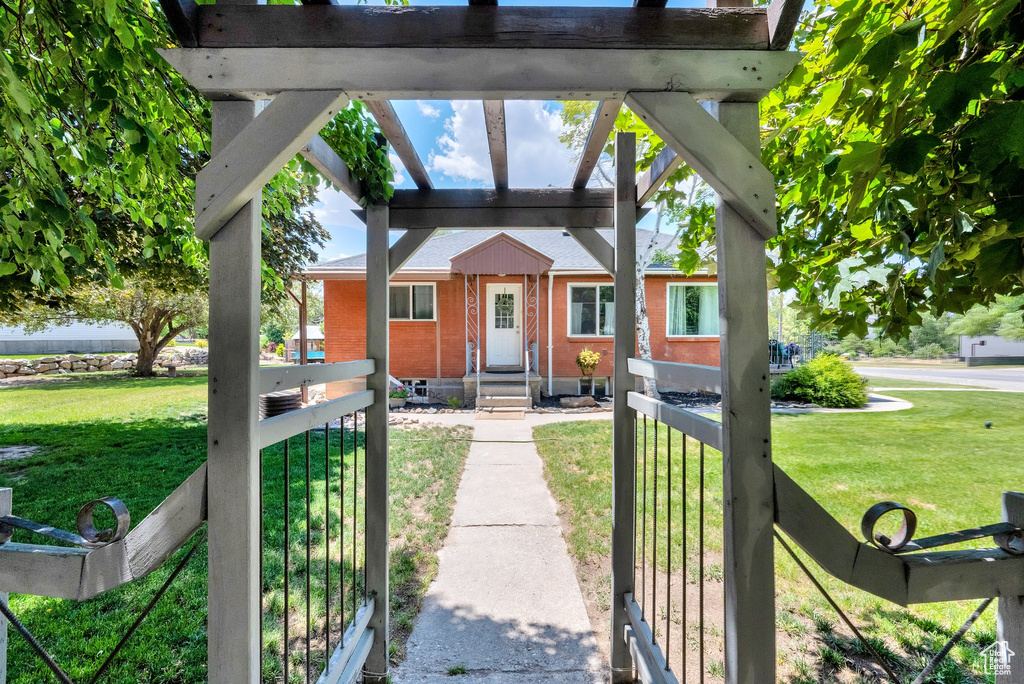 View of front of home featuring brick siding