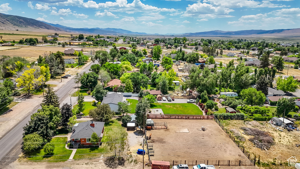 Aerial perspective of suburban area with a mountainous background