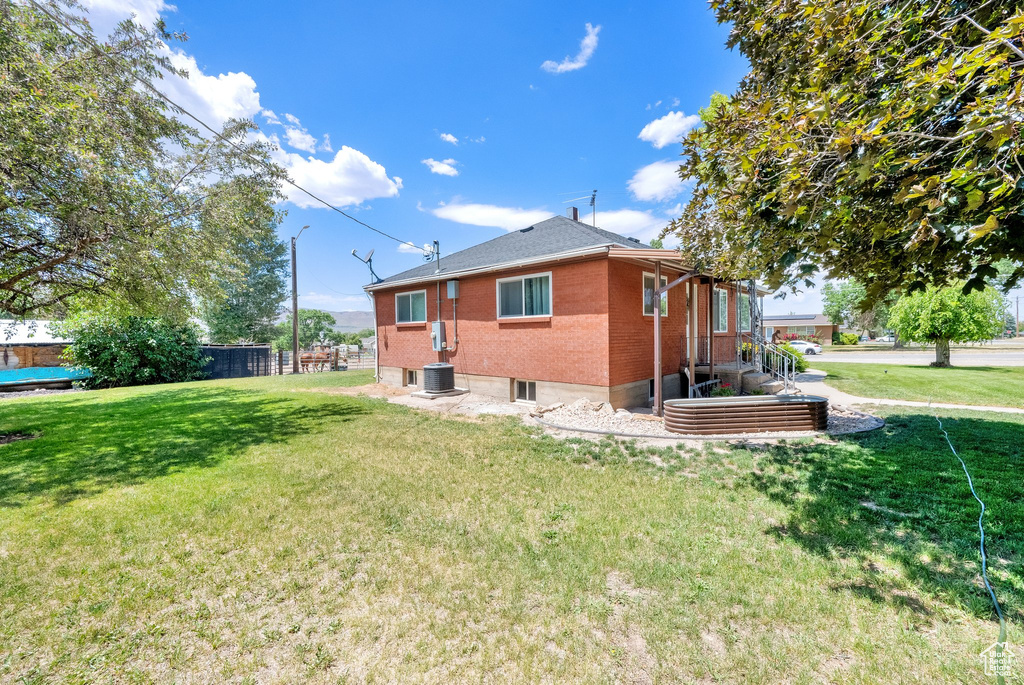 Back of house with brick siding