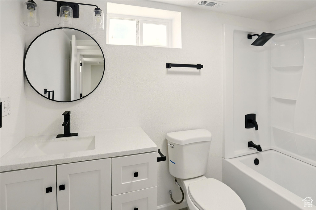 Bathroom with vanity and bathing tub / shower combination