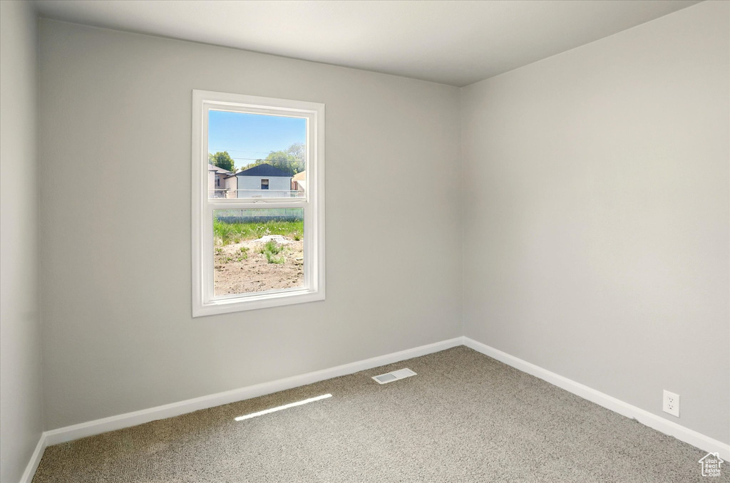 Empty room featuring carpet flooring
