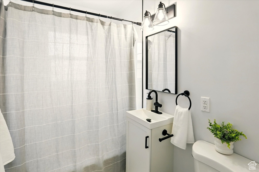 Bathroom featuring vanity and a shower with curtain