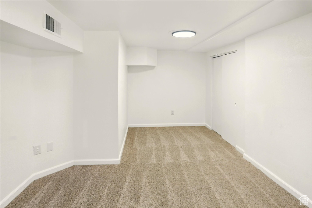Finished below grade area with light colored carpet