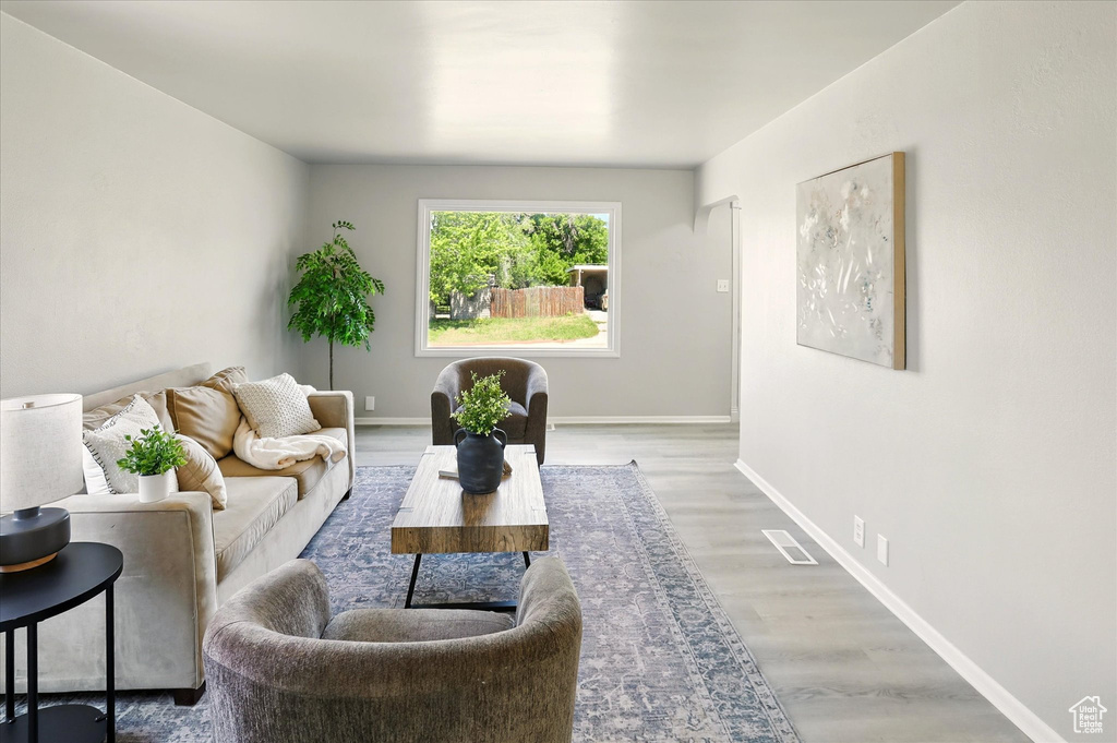 Living area featuring wood finished floors and baseboards