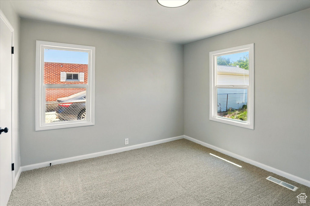 Unfurnished room with carpet