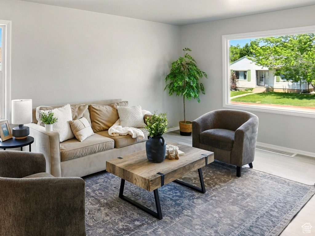 Living area featuring plenty of natural light and wood finished floors