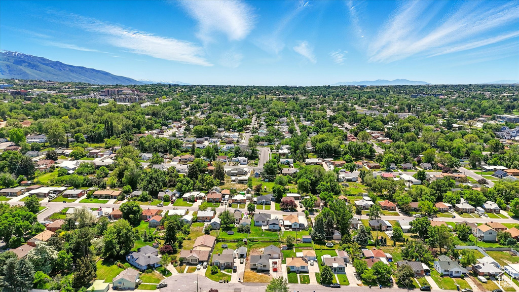 Aerial perspective of suburban area featuring a mountainous background