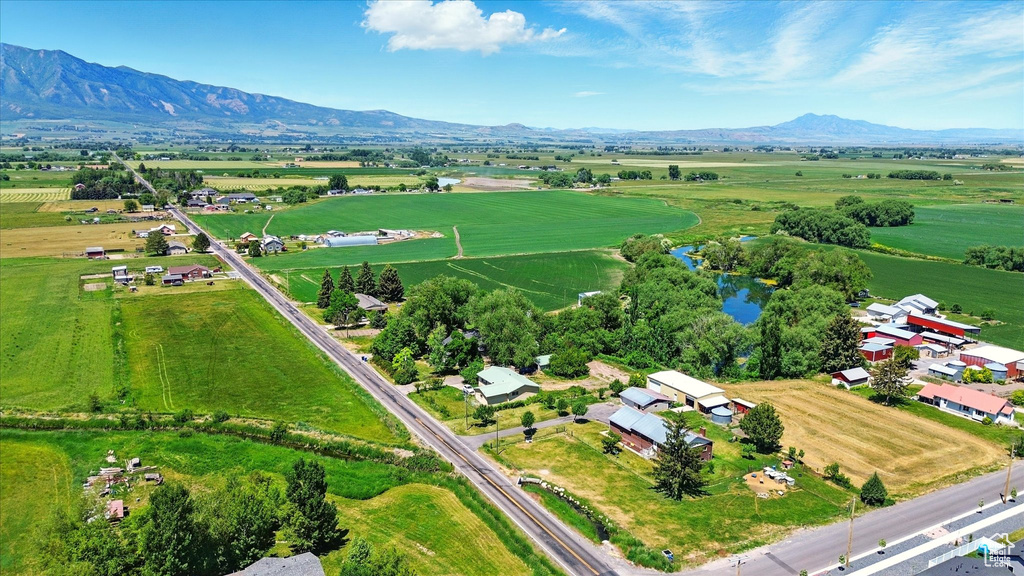Overview of rural landscape featuring a water and mountain view