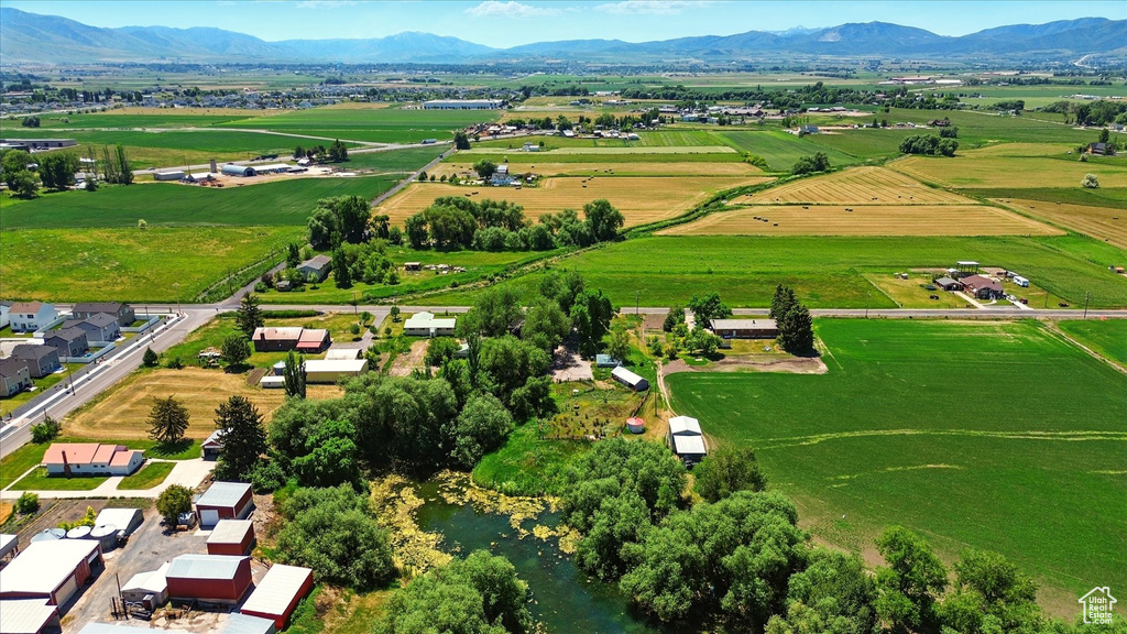 Aerial view of sparsely populated area with a mountainous background