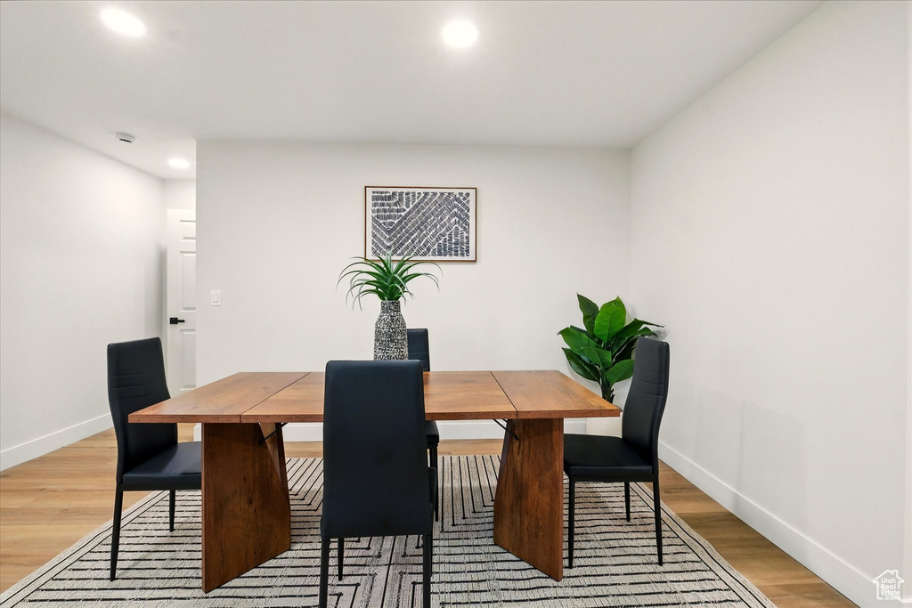 Dining space featuring recessed lighting and light wood finished floors